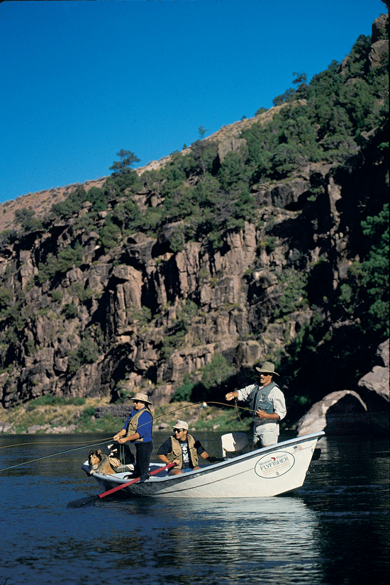 Fly anglers fishing out of a drift boat