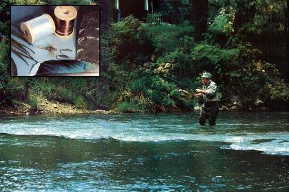 A fly angler high-stick nymphing on a verdant trout stream. 