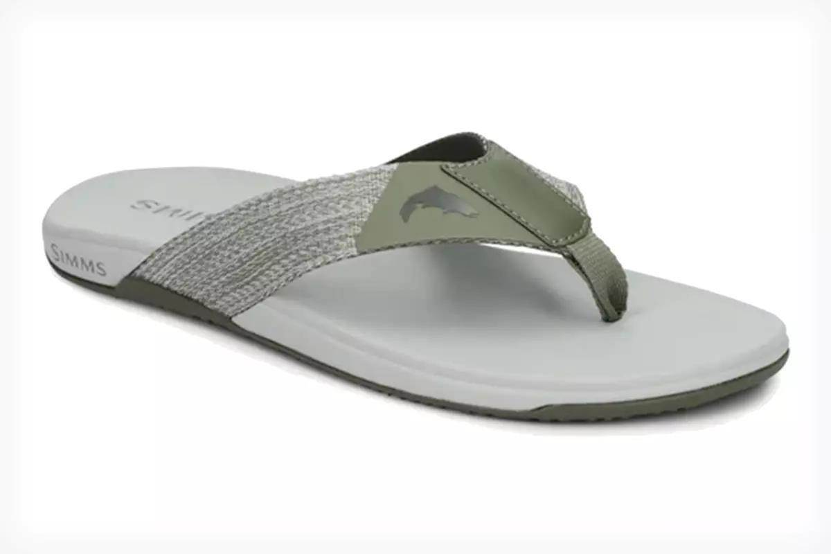 Studio photo of a gray flip flop; Simms Panga flip. 